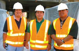 Teachers Timothy In (left), Curtis Goya and Jeff Cadiz explore the inner workings of the Moana Pacific’s mauka tower. Photo from Thelma Dreyer.