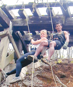 Carol Jaxon, this year’s Great Aloha Run race director, and husband Ed Bugarin rappel from a bridge on Koko Crater. Photo from Carol Jaxon.