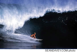 Current Pipeline master Jamie O'Brien racing the barrel at the Pipe