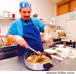 Anthony Romano prepares chicken cacciatore