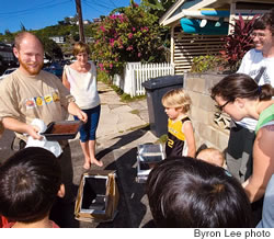 Jon Abbott produces cooked brownies from a homemade solar oven at The Green House in Pauoa Valley