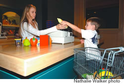 Jase Spargur goes on a healthy shopping spree in Baby Bear’s Mini Mart while mom Lindsey plays cashier