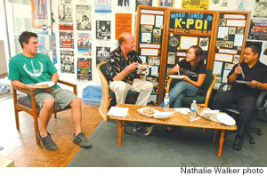 Tom Moffatt shares Chinese takeout with staffers, from left, Luke Wurpel, Mahealani Diego and Alan Arato