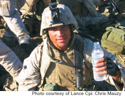 Lance Cpl. Chris Mauzy takes a break 8,000 feet up in Laghman Province, Afghanistan