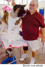 Hebry Kapali with Brutus, an American Akita