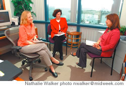 Adriana Ramelli with Christine Trecker, manager of prevention and education services (left), and Cindy Shimoni-Saito, manager of crisis and medical services