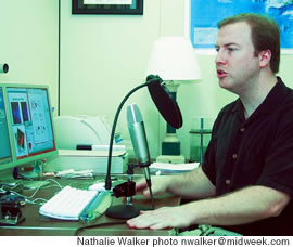 David Nickles records a class students will listen to on their iPods