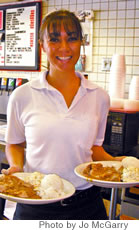 Gigi Kim serves up lunch at Tropics Diner