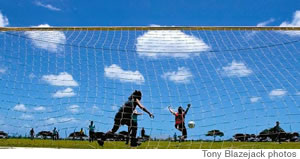 A soccer player shoots for a goal at the Waipio Soccer Complex