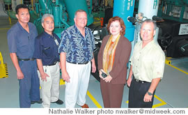 Taking a break in the company chiller room, Chelsea Group employees smile for the camera. From left: Hiep Lee, Paul Aragaki, George Benda, Liz Palmer and Scott Kuklish