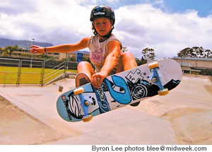 Cody Peer grabs a rail while catching some big air at the Mililani skate park