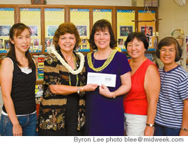 The McInerny Foundation awarded KCAA a $100,000 grant for quality initiatives, including curriculum training, on July 31. Accepting the grant check are (from left): Mizuho Yamaguchi, Paula Boyce, Christina Cox, Marilyn Kamiya and Julita Partido