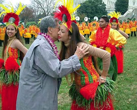 Akaka: Hug, kiss and sing, but don’t talk