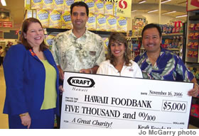 (from left) Polly Kauahi, director of development, Hawaii Foodbank, George Glukfeld, GM Safeway Hawaii, Sweetie Pacarro, spokesperson for Kraft Foods Hawaii and Gerald Shintaku, customer business manager for Kraft Foods Hawaii