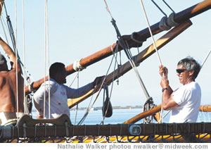 Nainoa Thompson hauls a line aboard the Hokulea