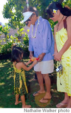 Kamalu Abad presents a school T-shirt to Don Ho and wife Haumea