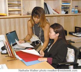 Dara reviews notes with personal assistant Darleen Daoang