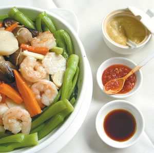 Fresh Seafood in a taro basket with Chinatown noodles is one of the many specialty dishes at Wah Kung Seafood Restaurant in Mapunapuna