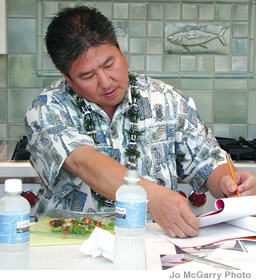 Alan Wong, pictured here judging the work of culinary students, is a board member and enthusiastic supporter of the culinary program at Leeward Community College. Their graduation project is a steal of a night for foodies!