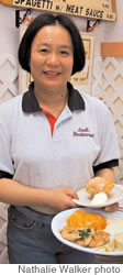 Michelle Lin serves up breakfast, including Jack’s Special Biscuits with honey butter at Jack’s in Aina Haina