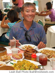 Anthony Chang orders up a feast of turnip cakes, fried taro, Singapore noodles, chicken feet, a rice noodle dish and more at Mei Sum Chinese Dim Sum on North Pauahi Street