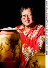 Jeff Chang shows off two pieces inlaid with horse hair