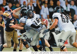 QBColt Brennan is sacked early in the third quarterwith Washington leading UH,28-21 