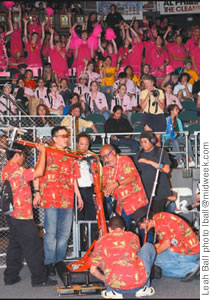 The Waialua High team makes last-minute adjustments to its bot