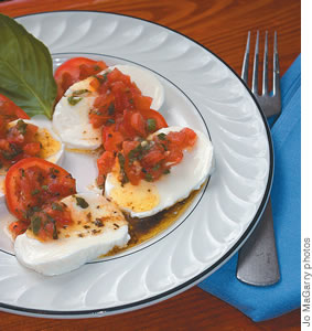 Caprese Salad at Café Sistina: fresh mozzarella, vine-ripened tomatoes, basil, garlic and extra-virgin olive oil