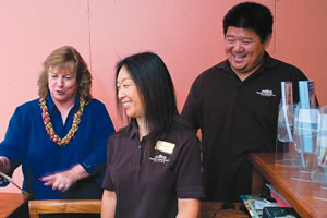 Marleen Akau with center staffers Miho Shimizo and Trevor Lee