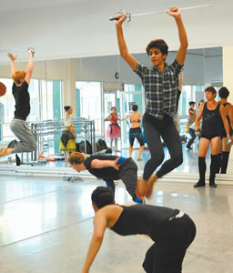 Costa Allen, with sword, rehearses a pirate scene