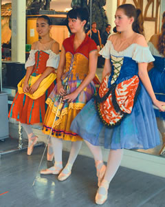 (from left) Courtney Schenberger, Michele Saruwatari and
Makena Miller take a break from rehearsal