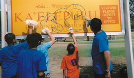 Windward Volcanoes Quincy, Kaimana, Alex, Noah, Austin and Patrick removed graffiti from this school sign during a busy weekend of cleaning up Kailua. Photos from Karen Igarashi.