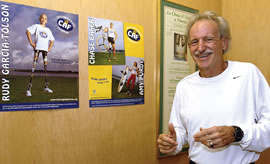 Kaneohe marathoner Don Fallis shows posters from the Challenged Athletes Foundation, a charity supported by an upcoming Death Valley race. Photo by Nathalie Walker